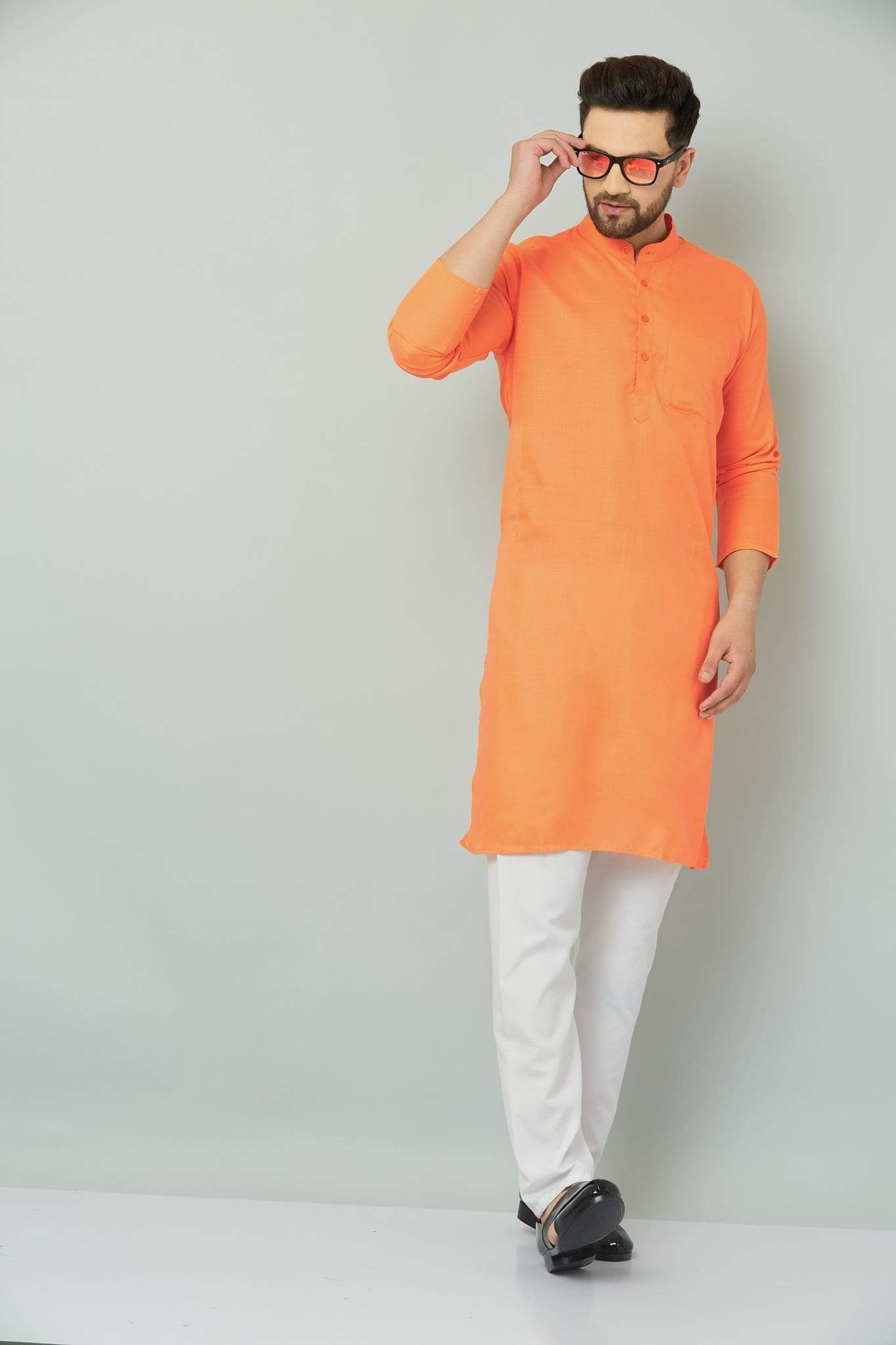p (6)-min Orange kurta with intricate patterns and designs.